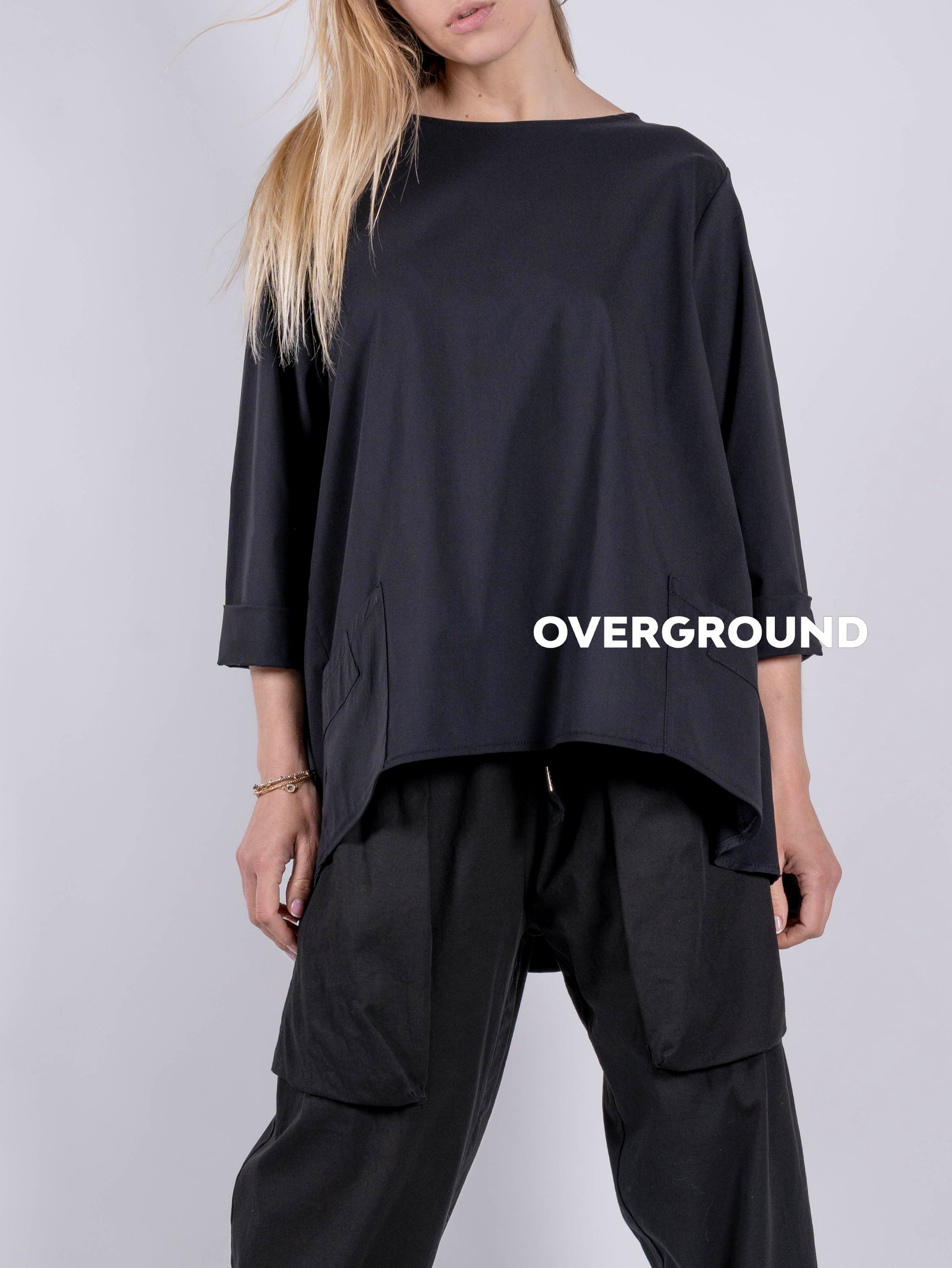BLUSA LARGA ASIMMETRICA CON TASCHE LATERALE - OVERGROUND STORE