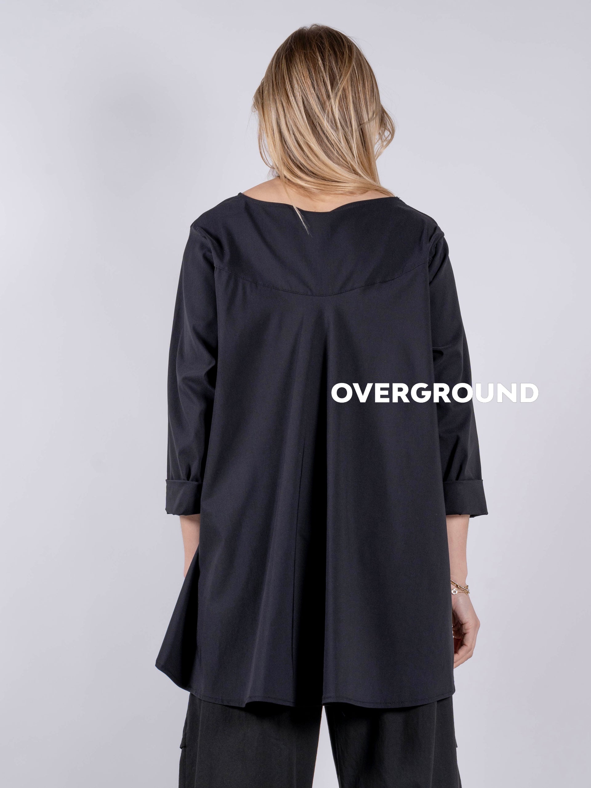 BLUSA LARGA ASIMMETRICA CON TASCHE LATERALE - OVERGROUND STORE