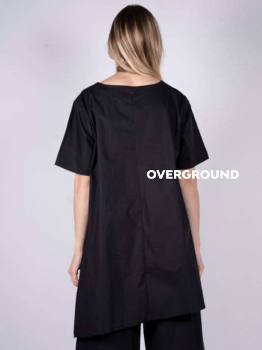 Maglia lunga asimmetrica con tasca laterale
