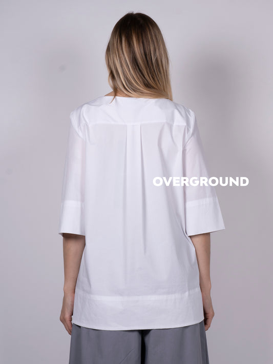 BLUSA CON BALZA DAVANTI ASIMMETRICA