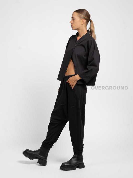 PANTALONE A CAVALLO BASSO CUCITURE E TASCHE FRONTALI