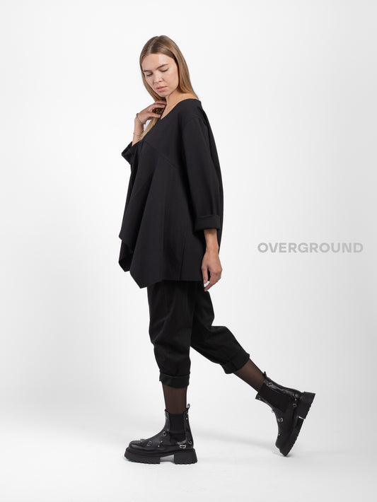 BLUSA OVER ASIMMETRICA SCOLLO A V