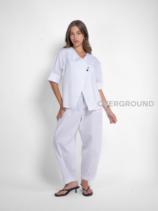 GIACCA ASIMMETRICA CON ABBOTTONATURA CENTRALE - OVERGROUND STORE