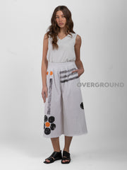 PANTALONE OVER CON MARGHERITE SUL GAMBULE - OVERGROUND STORE 