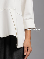 BLUSA OVER CON CUCITURE ASIMMETRICHE