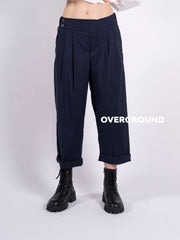 Wide gambule trousers with pleats and buttons