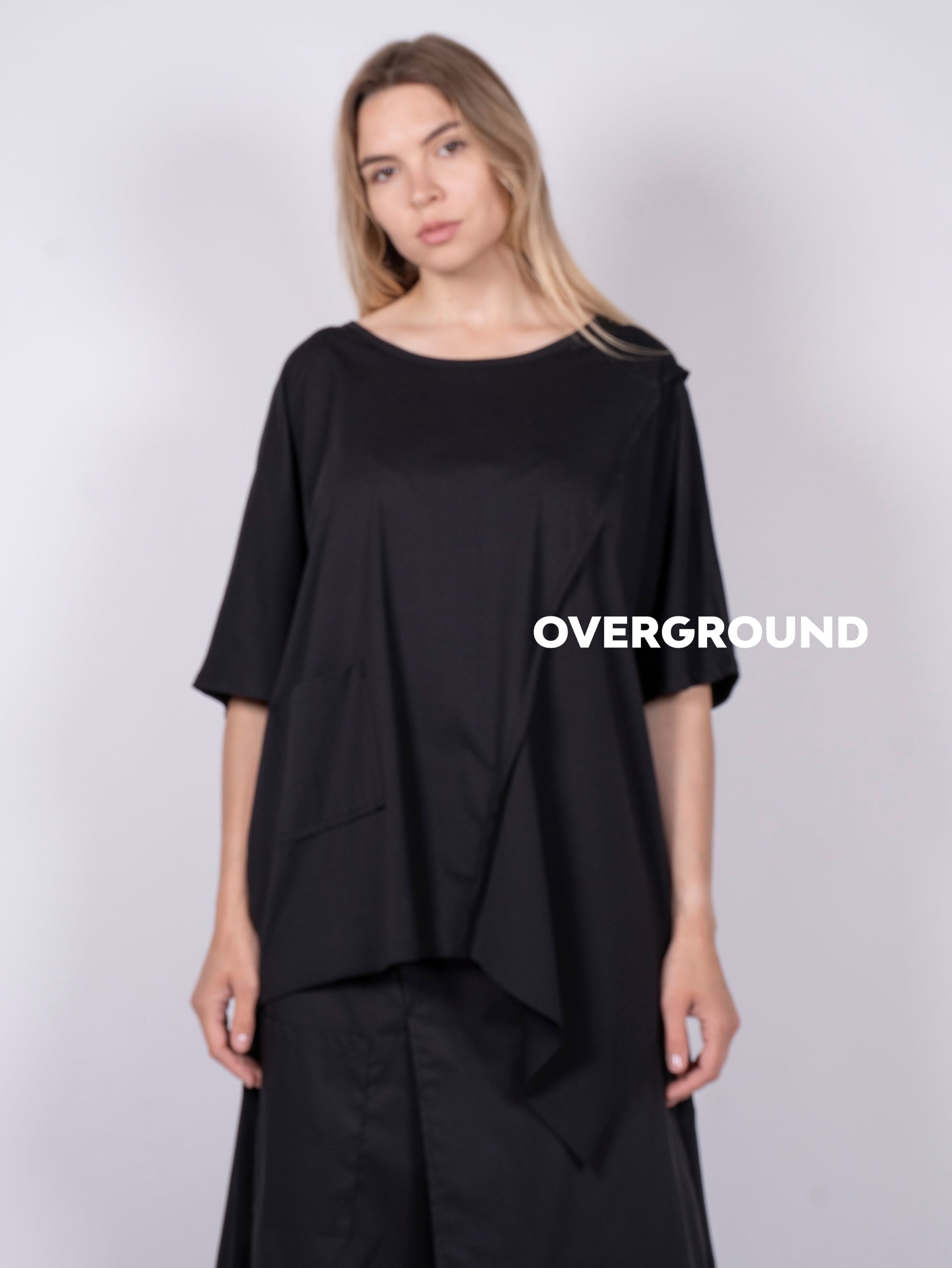 Maglia lunga asimmetrica con tasca laterale