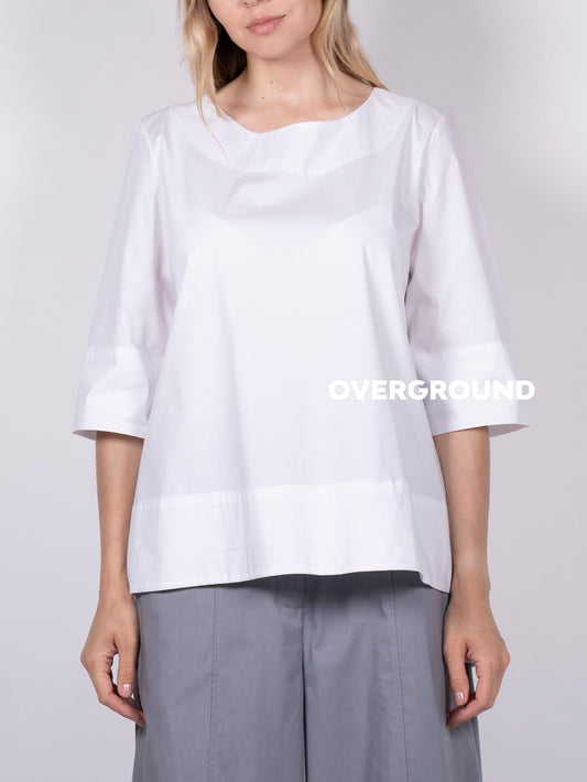 BLUSA CON BALZA DAVANTI ASIMMETRICA