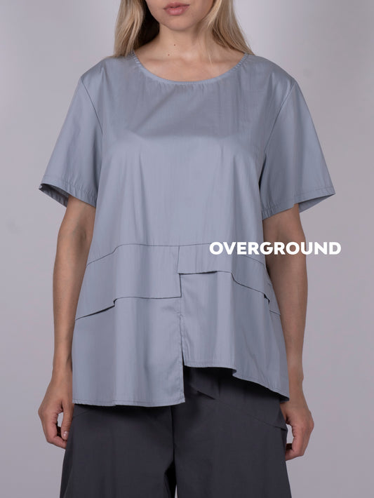 BLUSA ASIMMETRICA CON BALZA