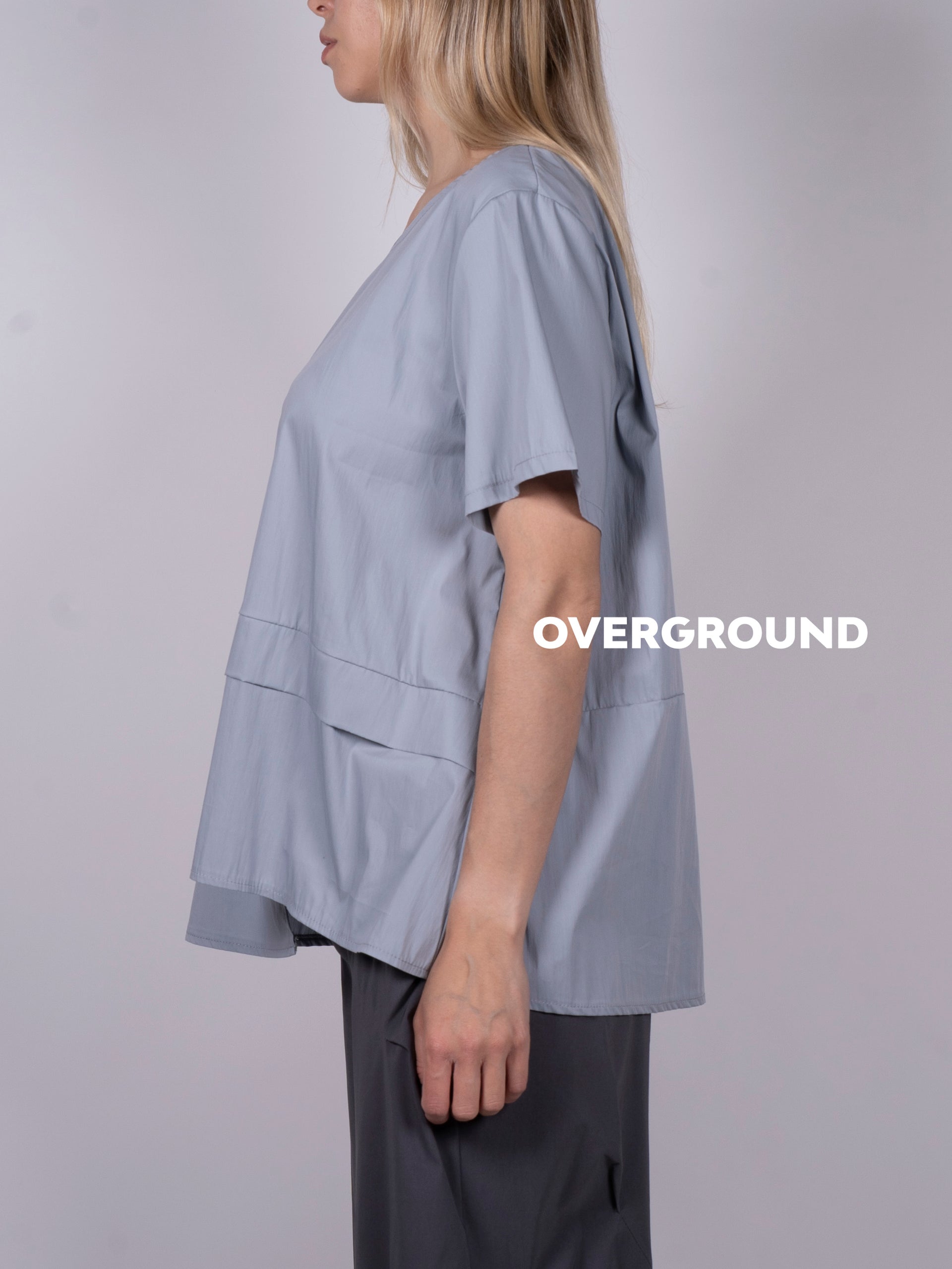BLUSA ASIMMETRICA CON BALZA