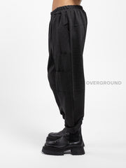PANTALONE OVER CON CUCITURE E TASCHE SUL GAMBULE