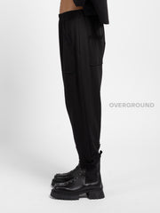 PANTALONE A CAVALLO BASSO CUCITURE E TASCHE FRONTALI