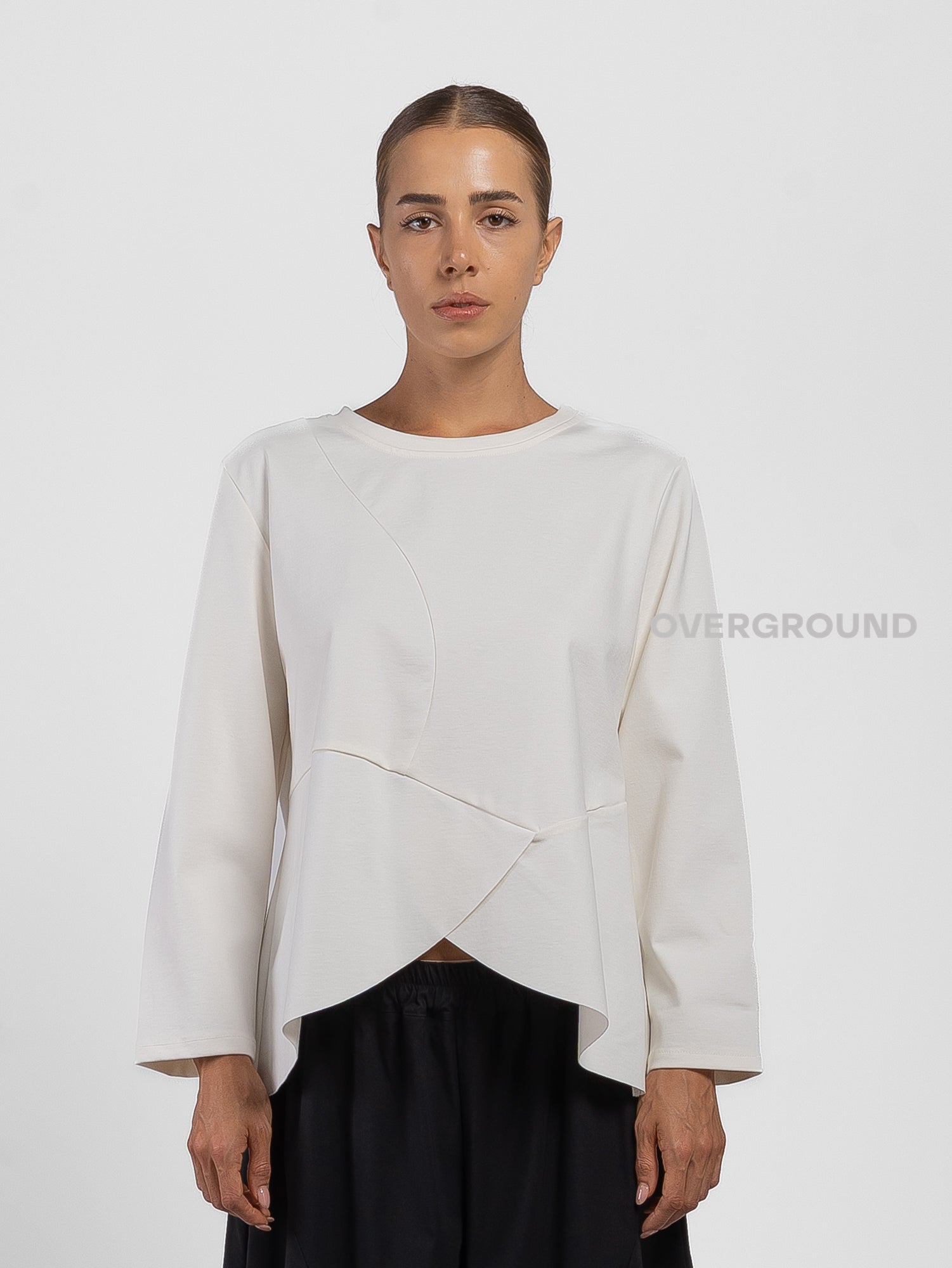 BLUSA CON CUCITURE STONDATA IN FONDO