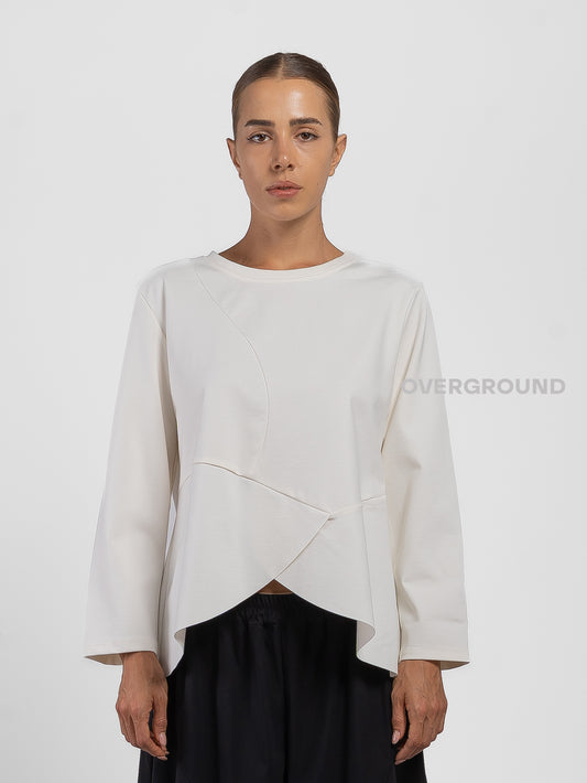 BLUSA CON CUCITURE STONDATA IN FONDO
