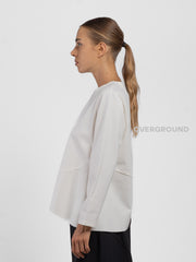 BLUSA CON CUCITURE STONDATA IN FONDO