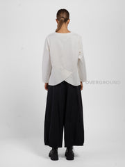 BLUSA CON CUCITURE STONDATA IN FONDO