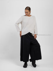 BLUSA CON CUCITURE STONDATA IN FONDO