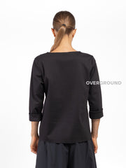 BLUSA CON CUCITURE E TASCA LATERALE