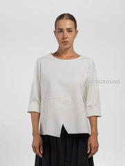 BLUSA CON CUCITURE E TASCA LATERALE
