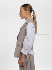 GILET ASIMMETRICO CON TASCA DAVANTI
