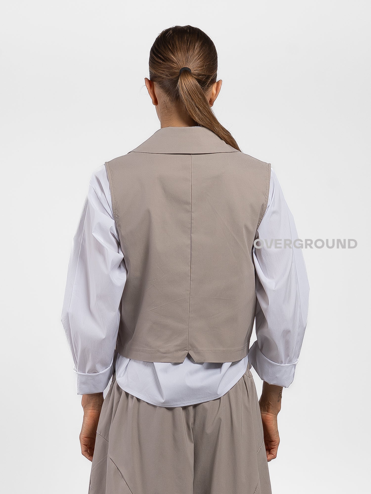 GILET ASIMMETRICO CON TASCA DAVANTI