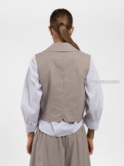 GILET ASIMMETRICO CON TASCA DAVANTI