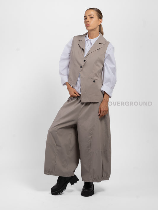 GILET ASIMMETRICO CON TASCA DAVANTI